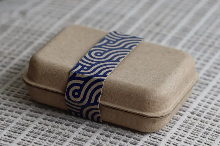 small clamshell with screen printed sleeve